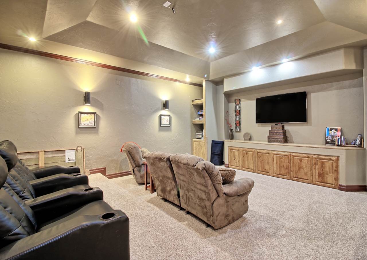 2029 K Road Fruita, CO 81521 - Photo 23 of 39 a living room with furniture and a flat screen tv