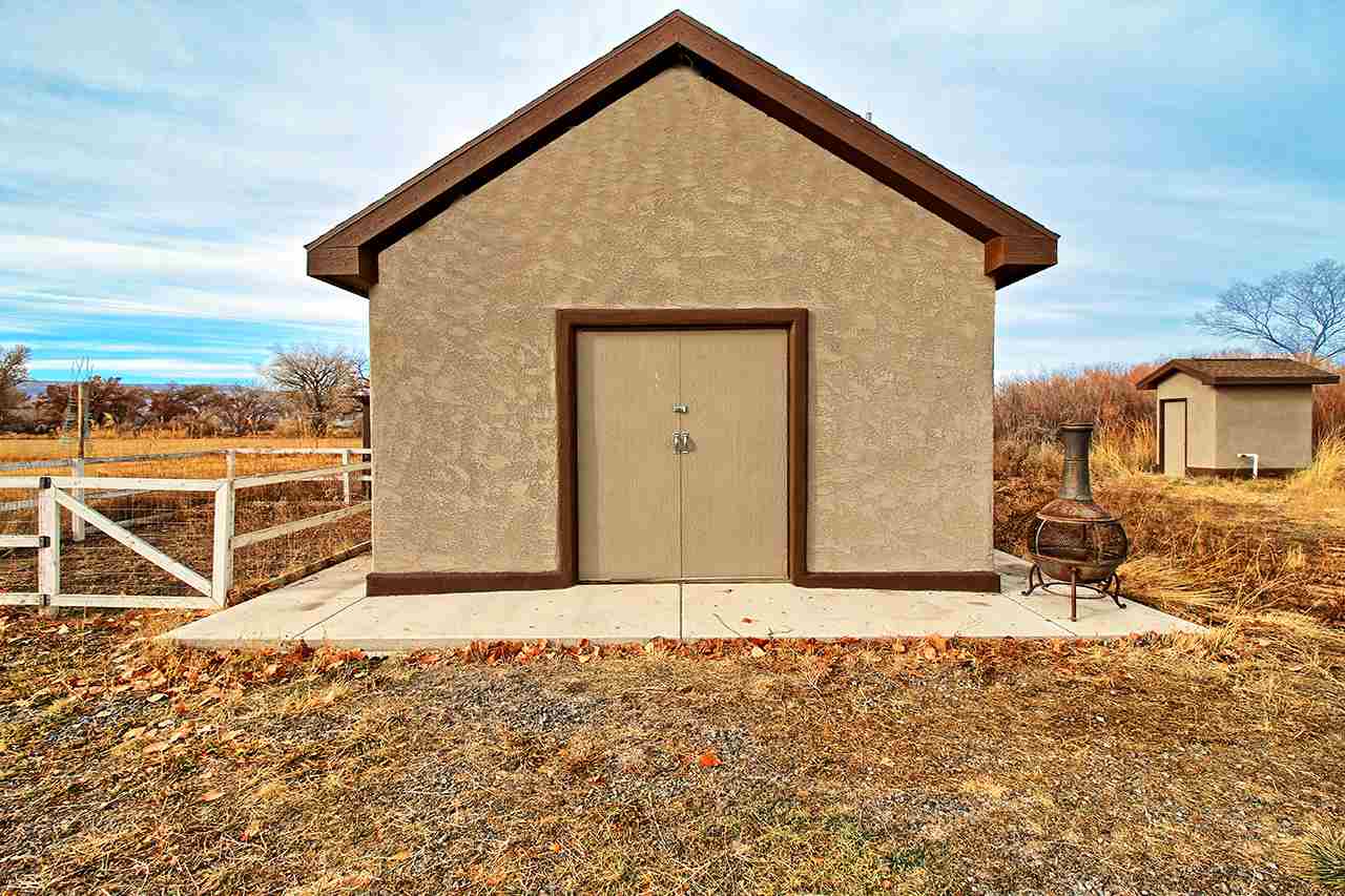2029 K Road Fruita, CO 81521 - Photo 36 of 39 a front view of a house with a yard
