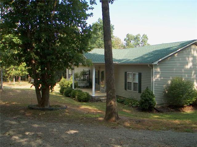 1922 Fortner Road Dickson, TN 37055 - Photo 2 of 20 Shady wooded private setting Try the swing or the rocking chair on the covered front porch