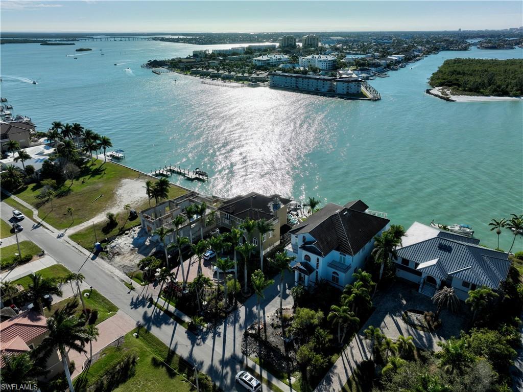 28 West Pelican Street Naples, FL 34113 - Photo 48 of 50 a view of lake and yard