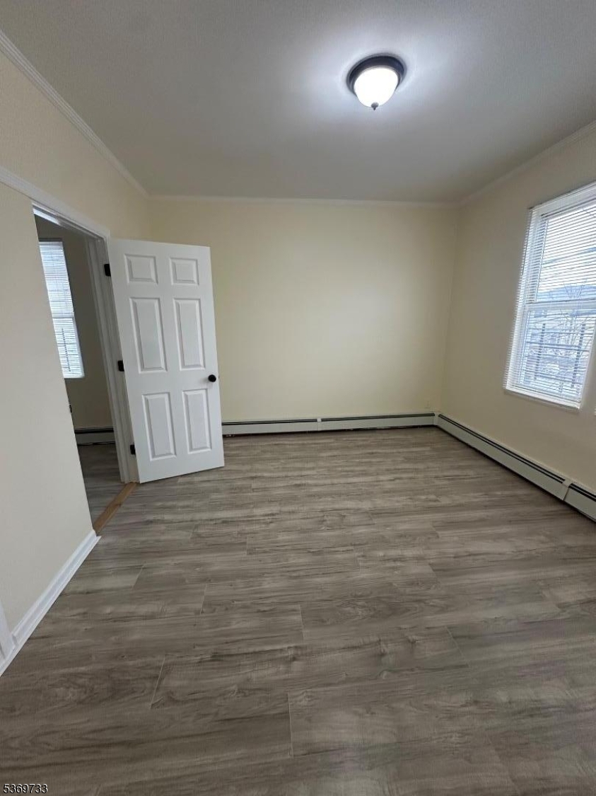 449 3rd Avenue, Unit 2 Elizabeth Port, NJ 07206 - Photo 5 of 11 a view of an empty room and window