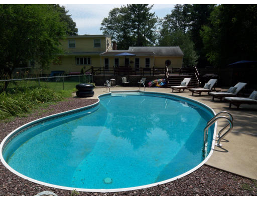93 Concord Road Chelmsford, MA 01824 - Photo 16 of 18 a view of a swimming pool with outdoor seating