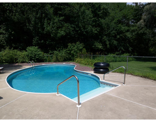 93 Concord Road Chelmsford, MA 01824 - Photo 17 of 18 a view of a swimming pool with a outdoor seating