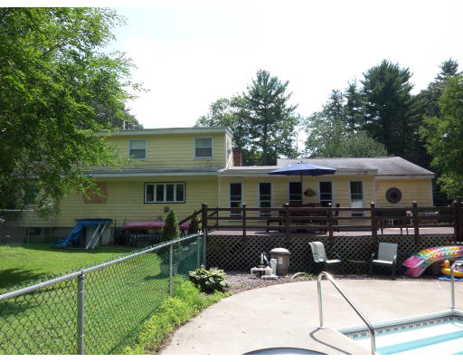 93 Concord Road Chelmsford, MA 01824 - Photo 18 of 18 a front view of a house with a yard