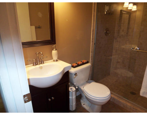 93 Concord Road Chelmsford, MA 01824 - Photo 8 of 18 a bathroom with a sink a toilet and shower