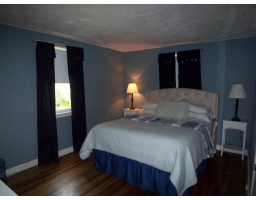 93 Concord Road Chelmsford, MA 01824 - Photo 10 of 18 a bedroom with a bed and a lamp