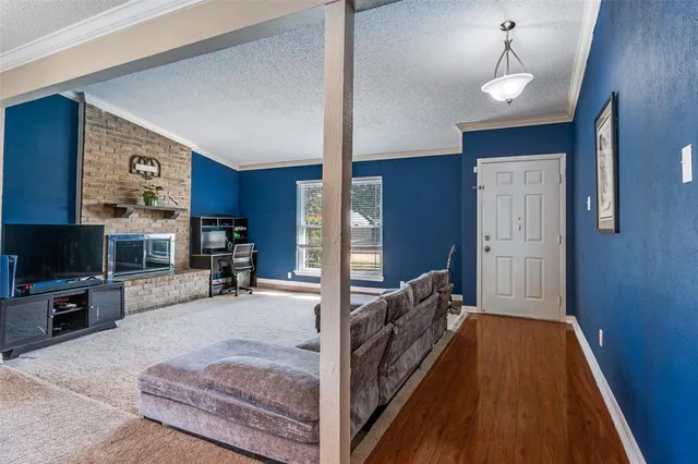 a bed room with furniture and a flat screen tv