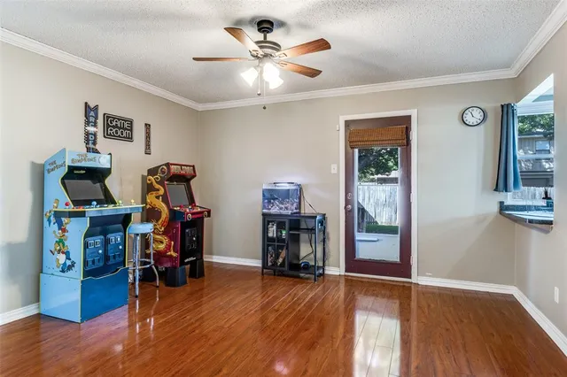 a view of a workspace with wooden floor