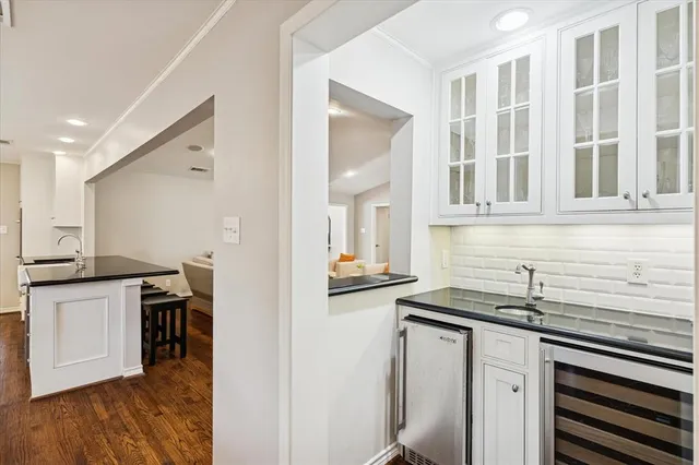 a kitchen with a stove and a window