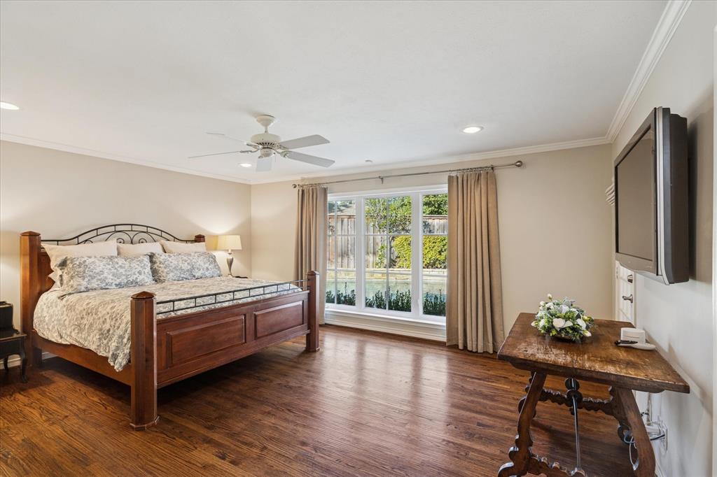 12650 Harriet Circle Dallas, TX 75244 - Photo 15 of 30 a spacious bedroom with a bed and a window