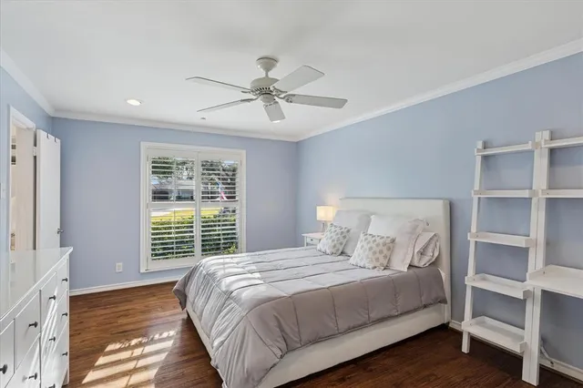 a en suite bathroom with a granite countertop sink and a large mirror