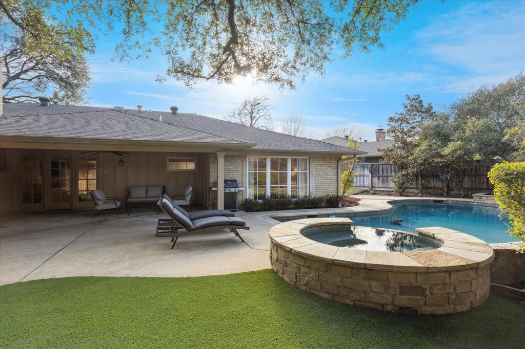 12650 Harriet Circle Dallas, TX 75244 - Photo 3 of 30 a view of a house with swimming pool and sitting area