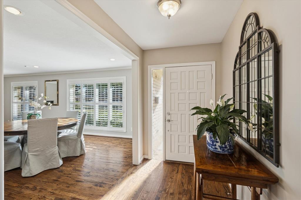 12650 Harriet Circle Dallas, TX 75244 - Photo 7 of 30 a dining room with furniture potted plants and wooden floor