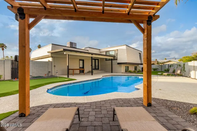 a front view of a house with swimming pool