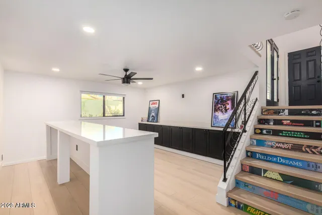 a view of a kitchen with a sink and a refrigerator