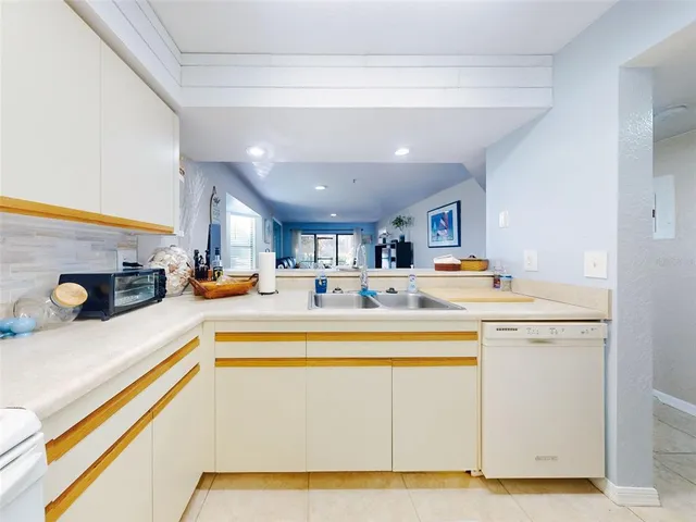 a bathroom with a sink toilet tub and shower