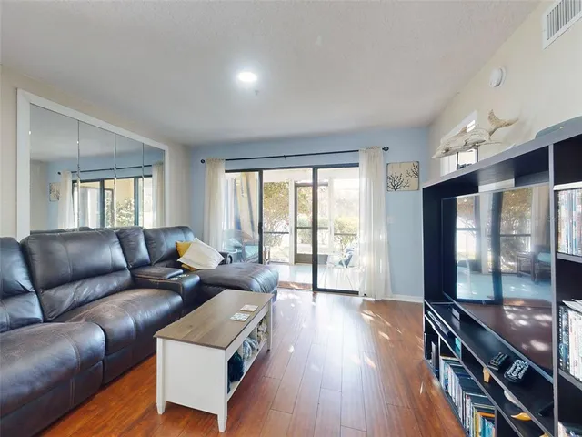 a room with a bed and a large mirror