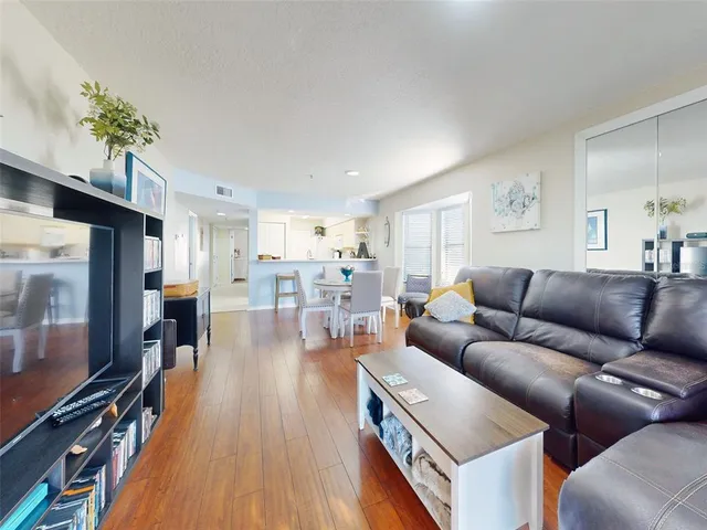 a bedroom with a large bed and a large window