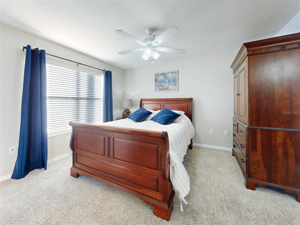 400 Bouchelle Drive, Unit 101 New Smyrna Beach, FL 32169 - Photo 36 of 63 a bedroom with a bed and a window