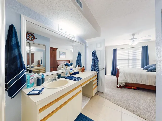 a view of a chairs and table in backyard