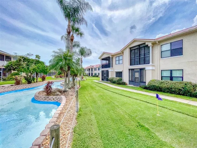 an aerial view of a house with a swimming pool yard and outdoor seating