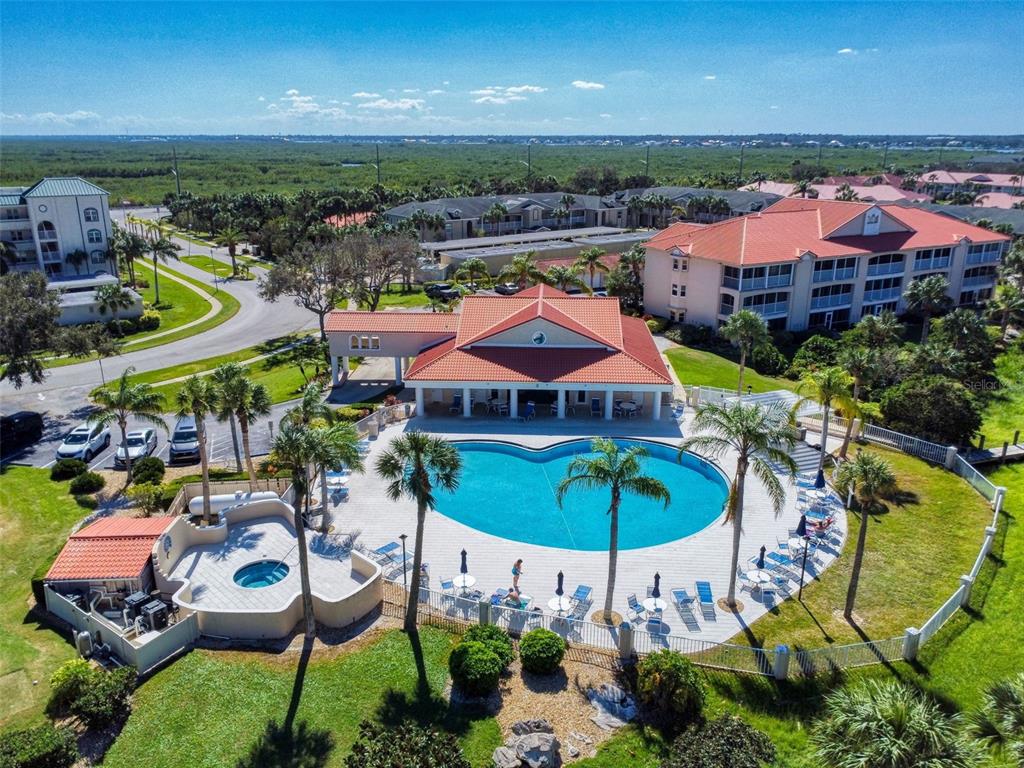 400 Bouchelle Drive, Unit 101 New Smyrna Beach, FL 32169 - Photo 59 of 63 an aerial view of a house with a swimming pool yard and outdoor seating