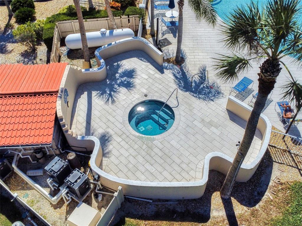 400 Bouchelle Drive, Unit 101 New Smyrna Beach, FL 32169 - Photo 60 of 63 a view of balcony with two chairs and a potted plant