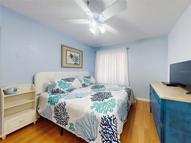 a kitchen with a refrigerator and a sink