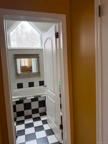 a bathroom with a mirror and a sink