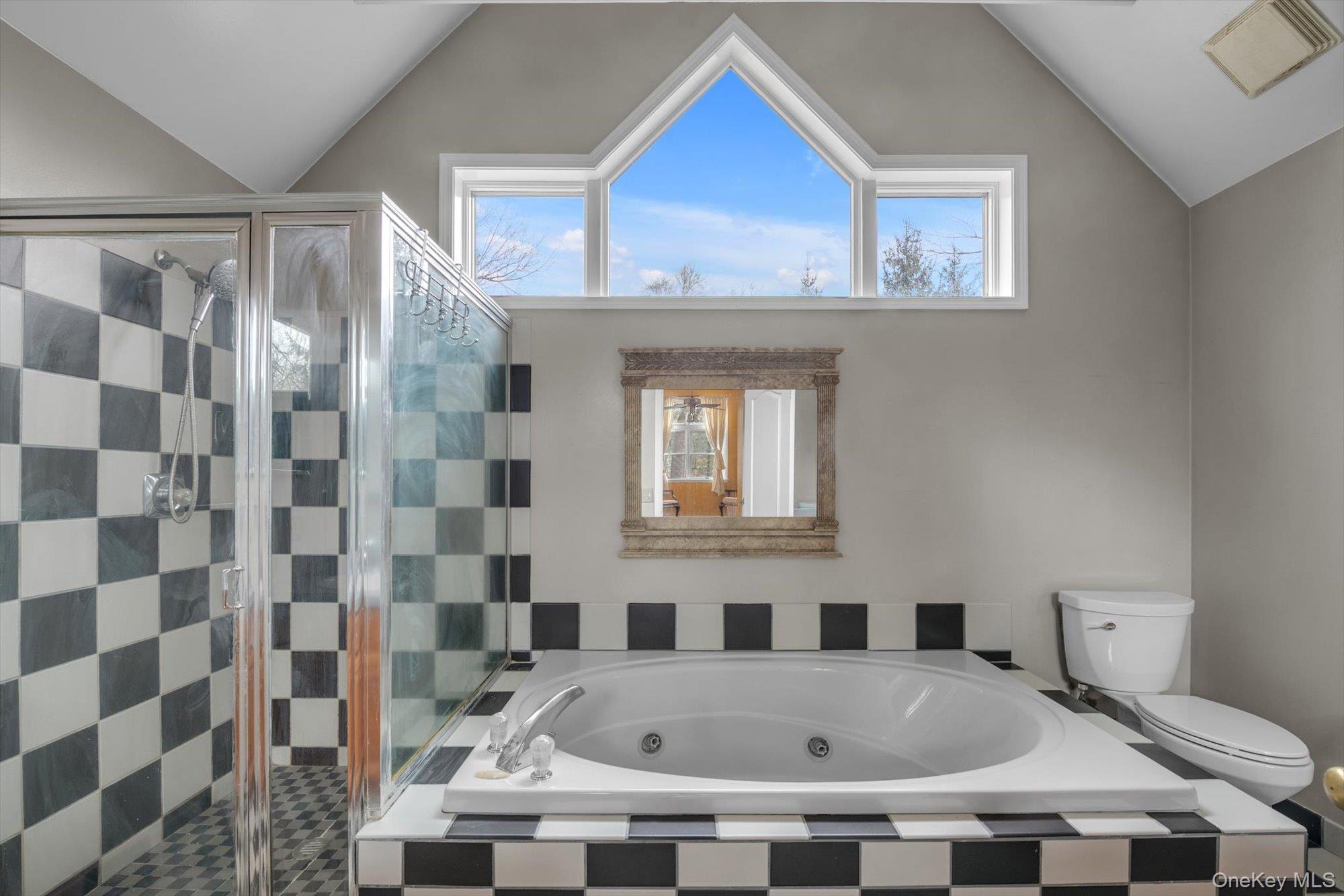 4 Greenlawn Road Cortlandt Manor, NY 10567 - Photo 14 of 26 a bathroom with a bathtub and a shower