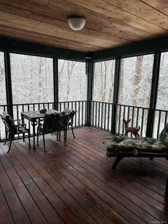 a view of a patio with wooden floor