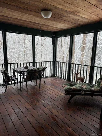 a view of a patio with wooden floor