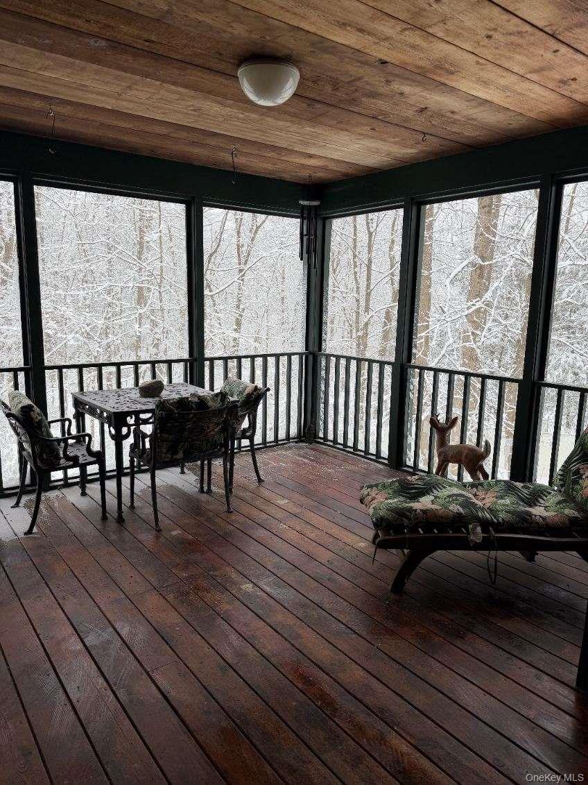 4 Greenlawn Road Cortlandt Manor, NY 10567 - Photo 14 of 24 Sunroom / solarium featuring healthy amount of natural light and a deck