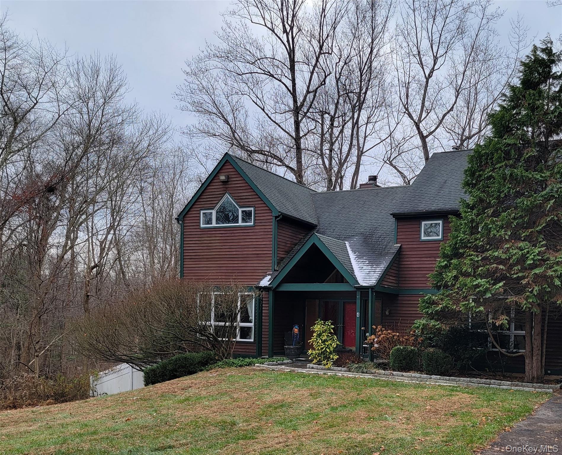 4 Greenlawn Road Cortlandt Manor, NY 10567 - Photo 16 of 24 View of front facade featuring a front lawn, a shingled roof, and a chimney