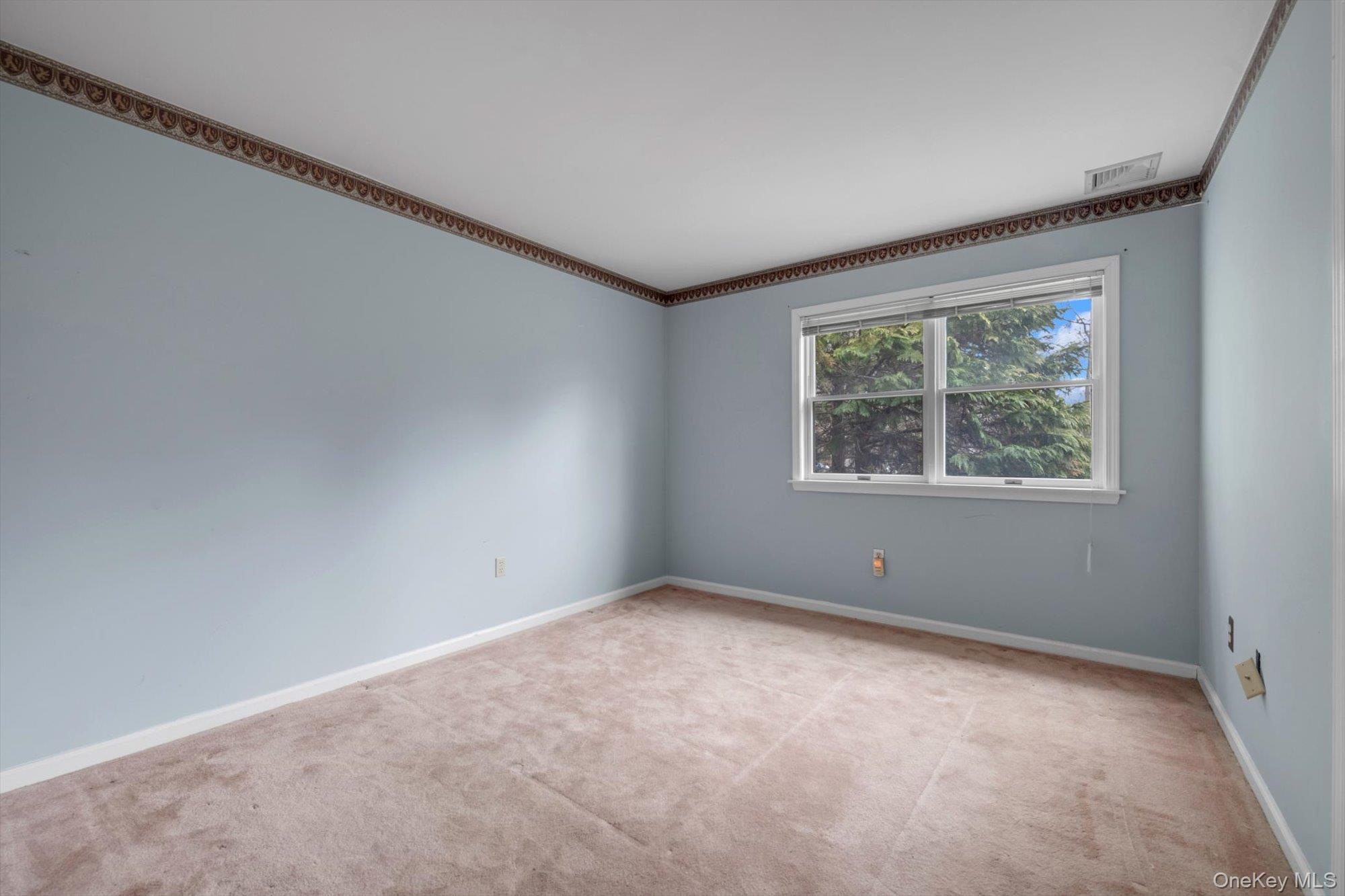 4 Greenlawn Road Cortlandt Manor, NY 10567 - Photo 18 of 26 an empty room with windows
