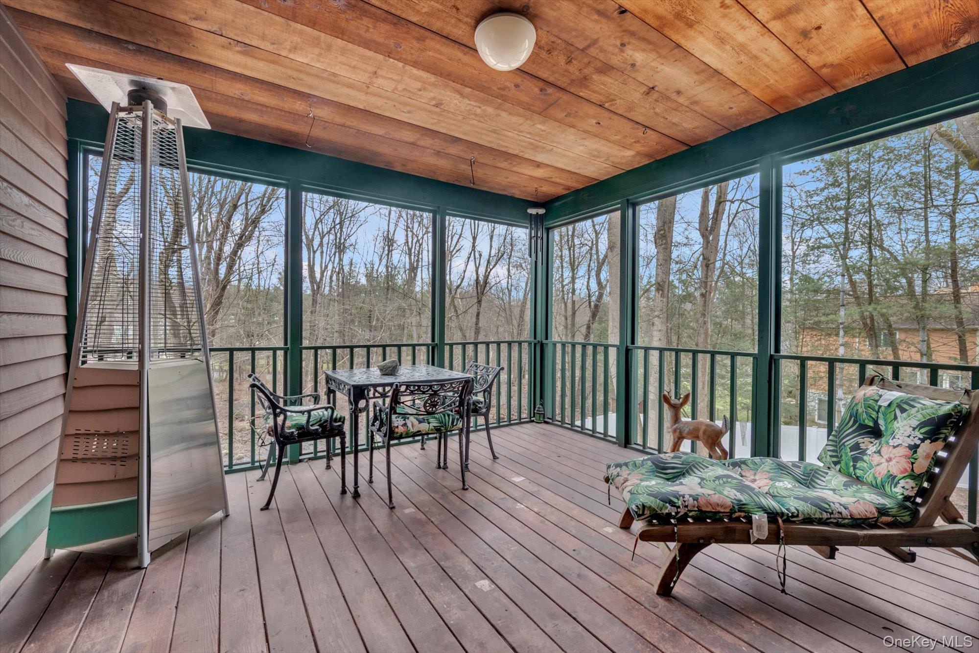 4 Greenlawn Road Cortlandt Manor, NY 10567 - Photo 19 of 26 a balcony with wooden floor table and chairs