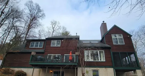 a front view of residential houses with yard