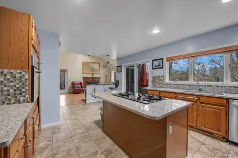 a kitchen with stainless steel appliances granite countertop a stove and a sink