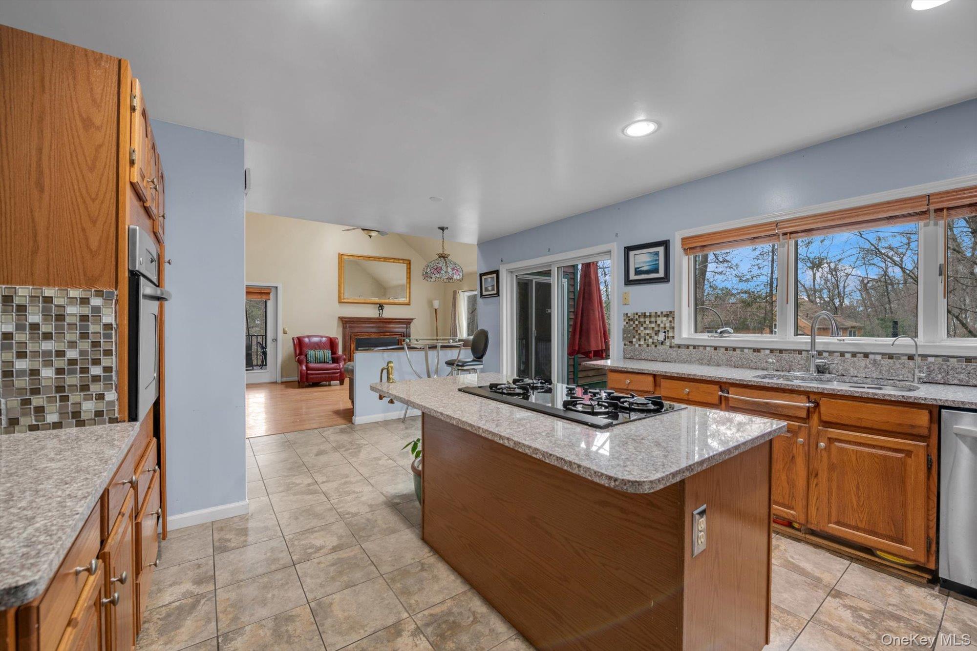 4 Greenlawn Road Cortlandt Manor, NY 10567 - Photo 5 of 26 a kitchen with stainless steel appliances granite countertop a stove and a sink