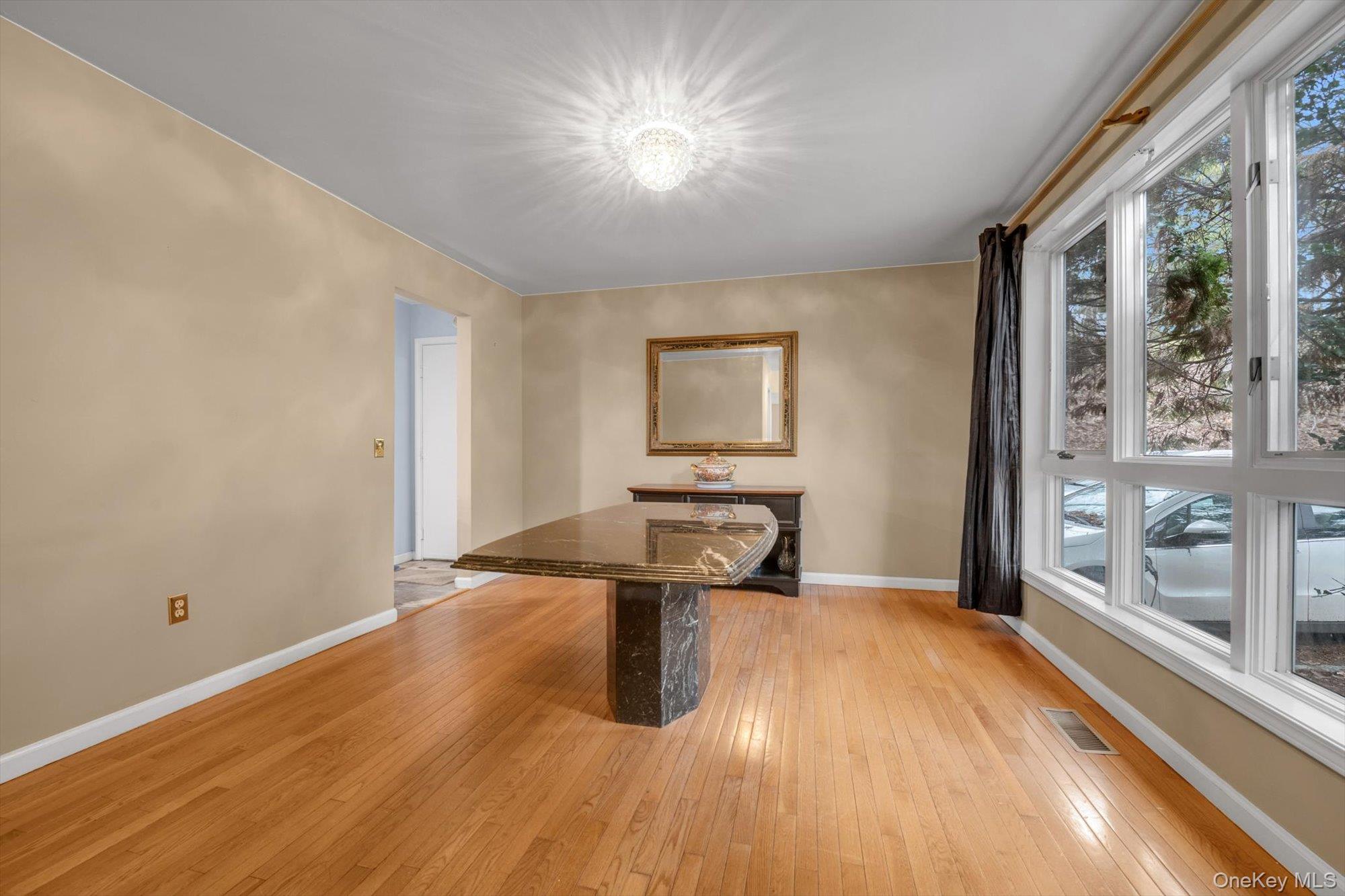 4 Greenlawn Road Cortlandt Manor, NY 10567 - Photo 10 of 26 a view of empty room with wooden floor and fan