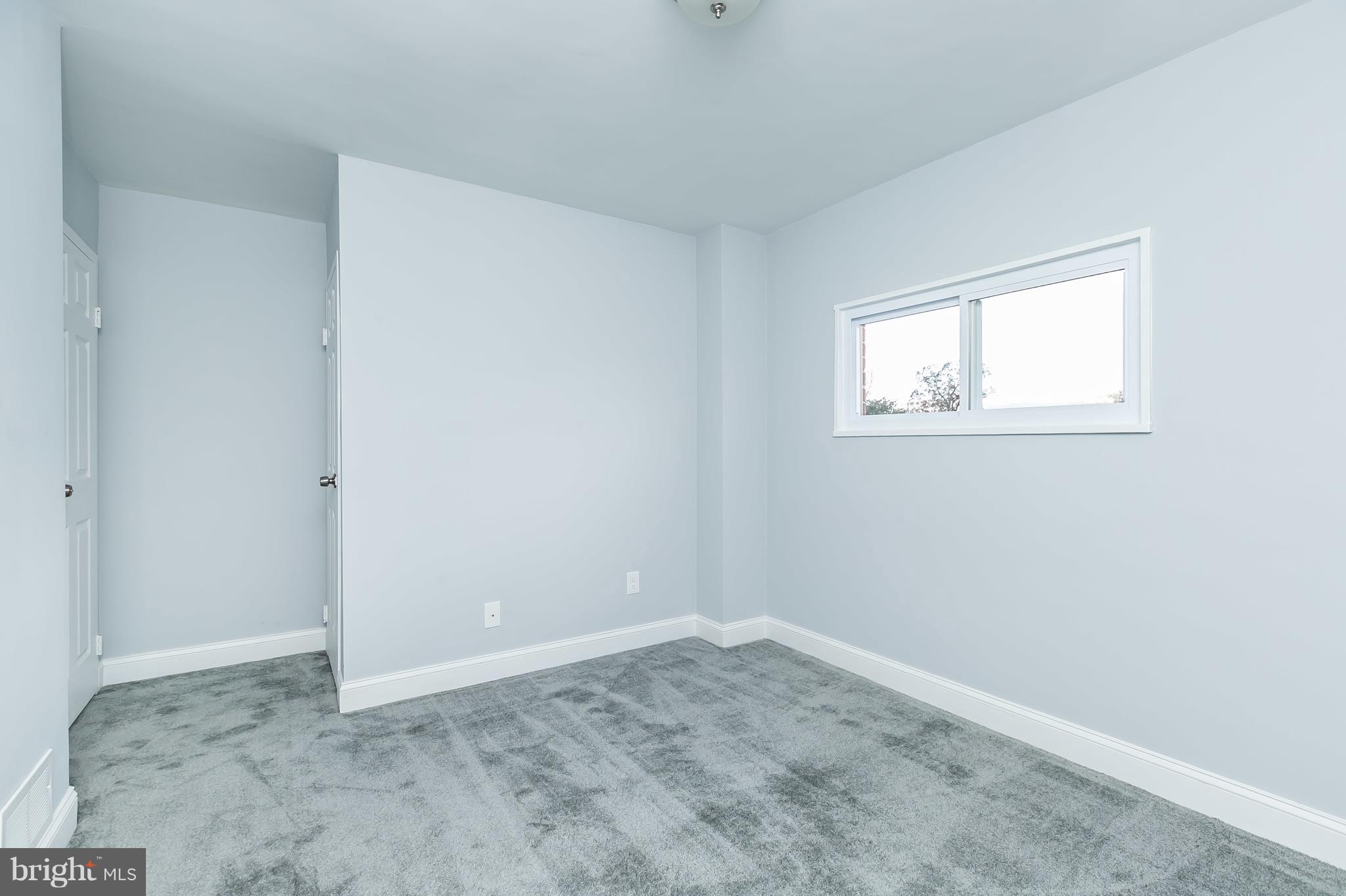 7808 Charlesmont Road Baltimore, MD 21222 - Photo 18 of 32 an empty room with a window