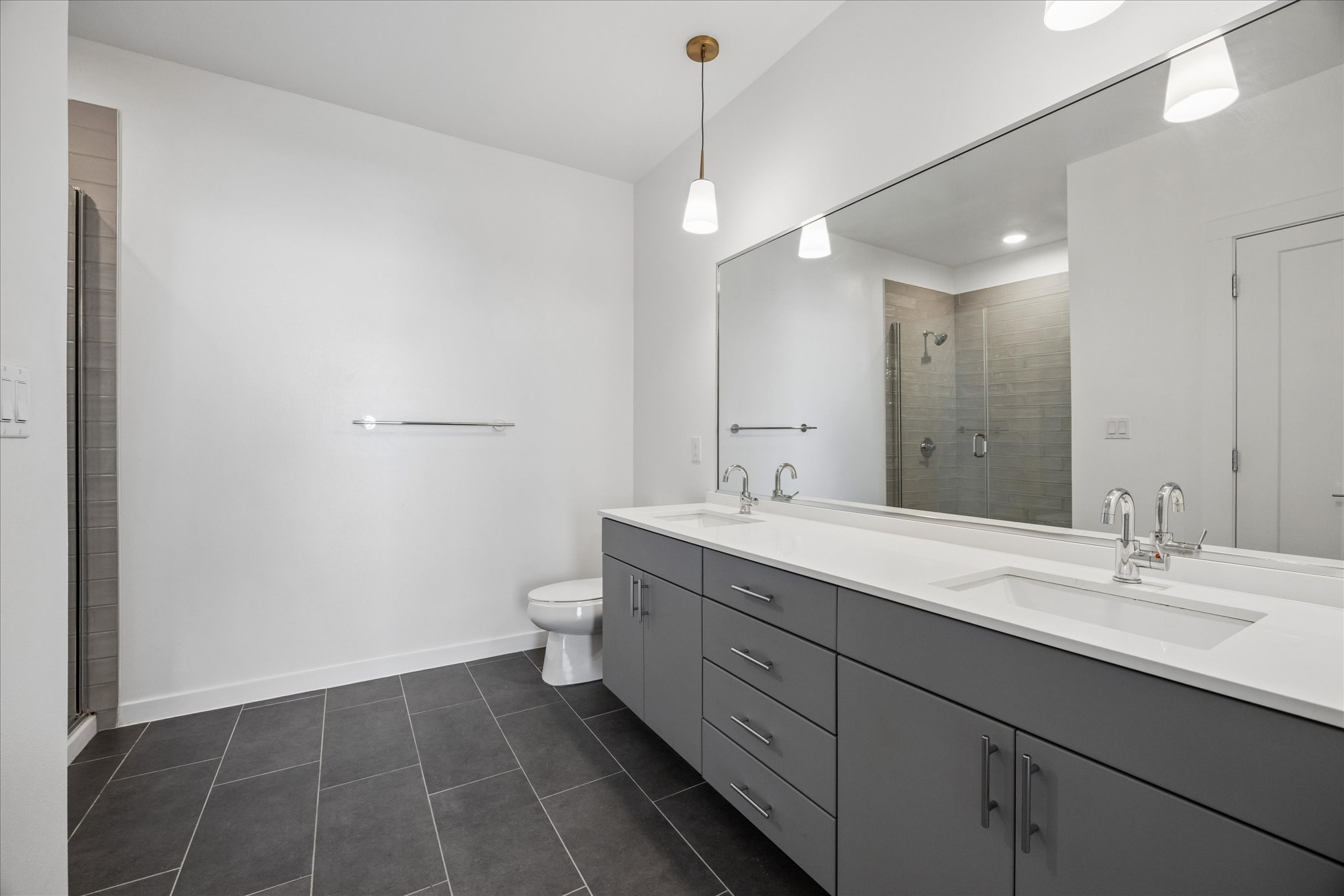 4801 Springdale Road, Unit 2210 Austin, TX 78723 - Photo 6 of 14 The primary bathroom has double vanities and a walk-in shower