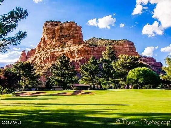 70 Courthouse Butte Road, Unit 114 Sedona, AZ 86351 - Photo 11 of 11 a view of a big yard with a large swimming pool and outdoor seating