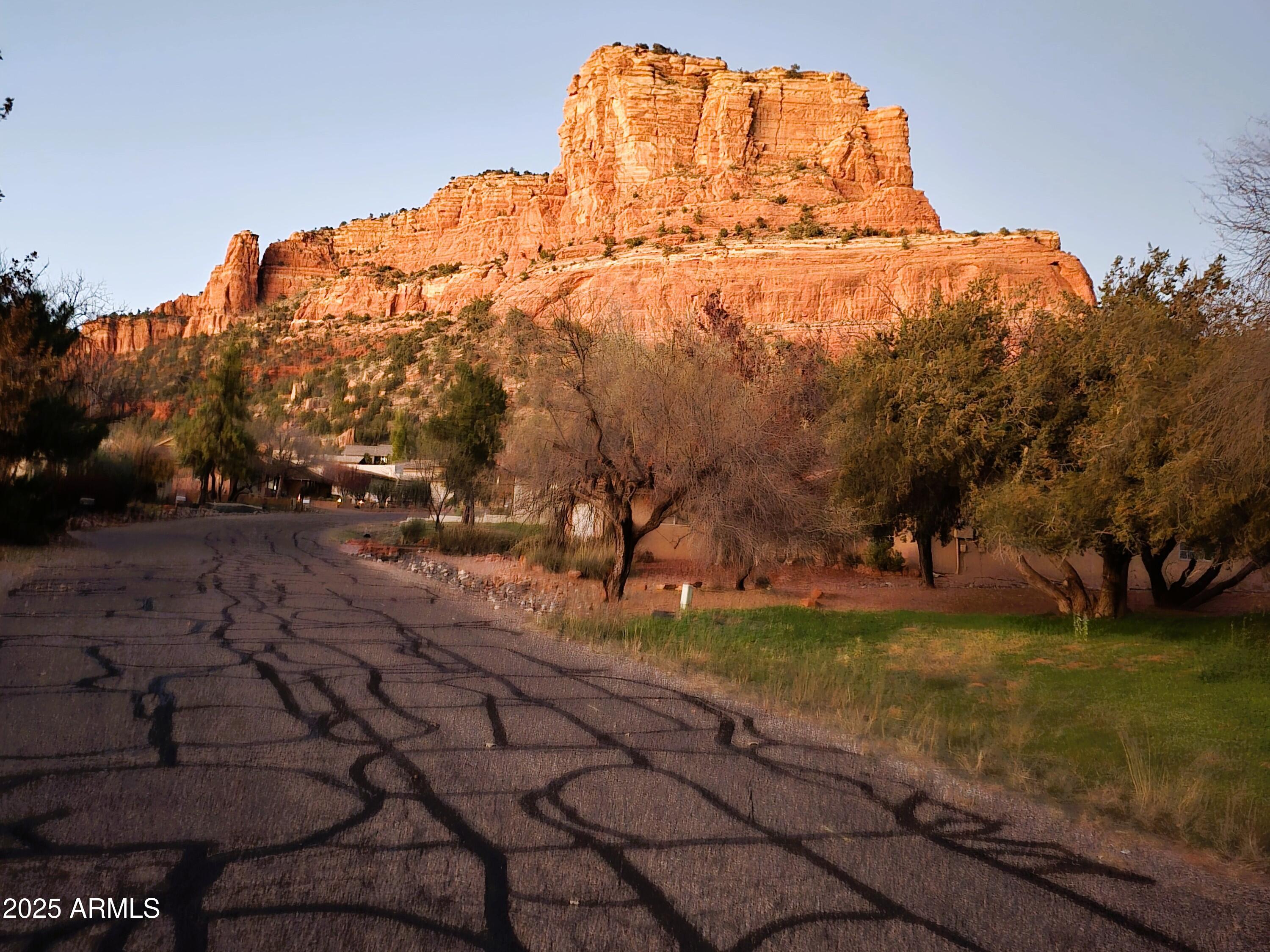 70 Courthouse Butte Road, Unit 114 Sedona, AZ 86351 - Photo 2 of 11 a backyard of a house with lots of green space