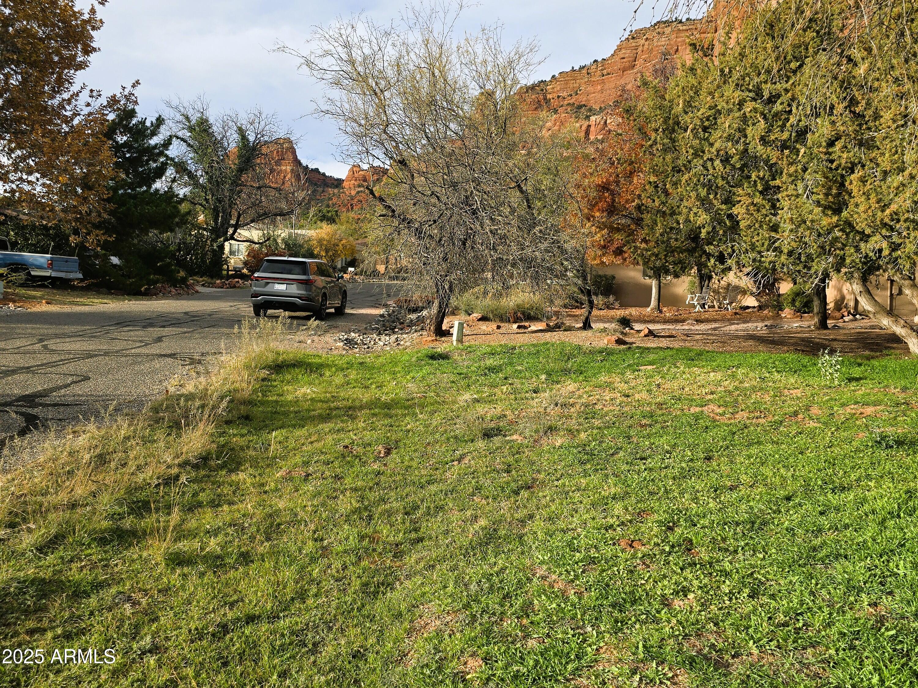 70 Courthouse Butte Road, Unit 114 Sedona, AZ 86351 - Photo 6 of 11 a view of a yard with large trees