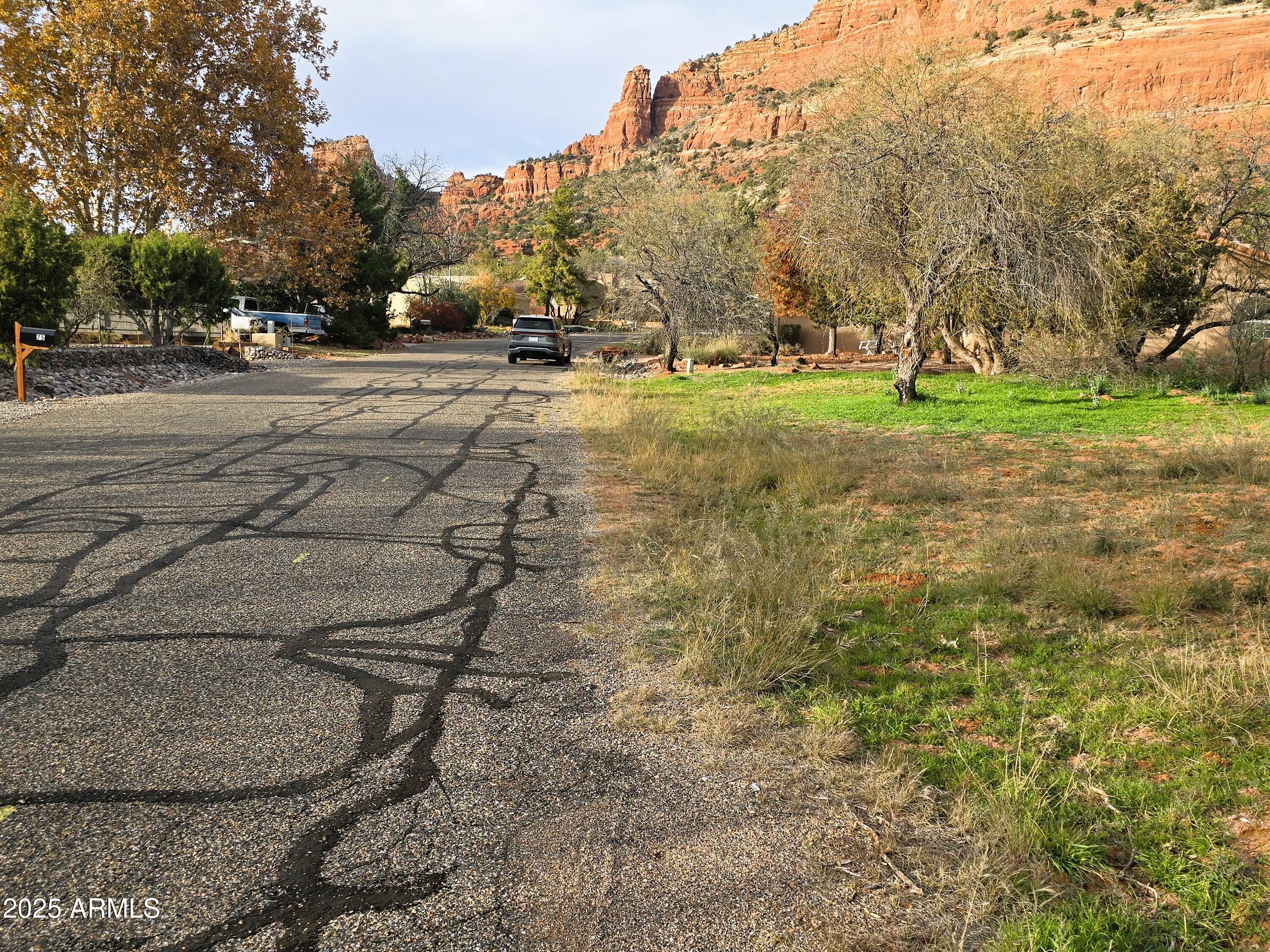 70 Courthouse Butte Road, Unit 114 Sedona, AZ 86351 - Photo 7 of 11 a backyard of a house with lots of green space