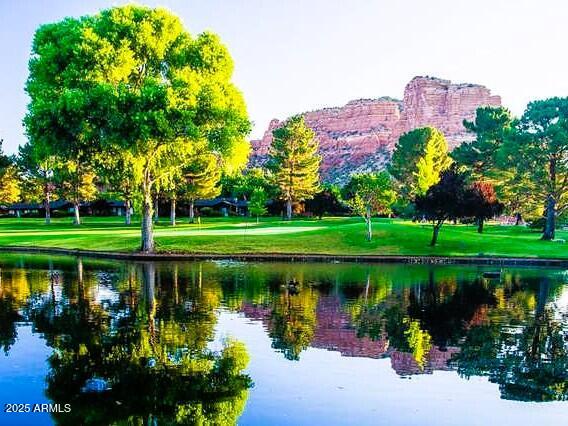 70 Courthouse Butte Road, Unit 114 Sedona, AZ 86351 - Photo 9 of 11 a lake view with a big yard and potted plants
