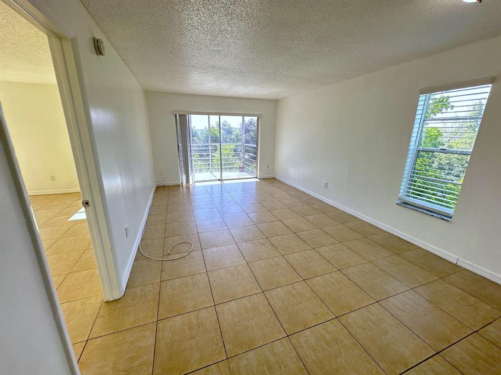2800 Northwest 56th Avenue, Unit E407 Lauderhill, FL 33313 - Photo 2 of 15 a view of entryway with stairs and wooden floor