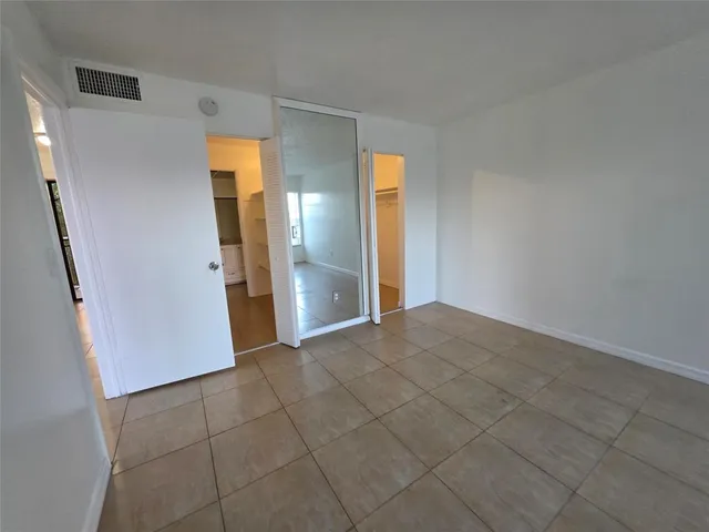 a view of a room with a hallway