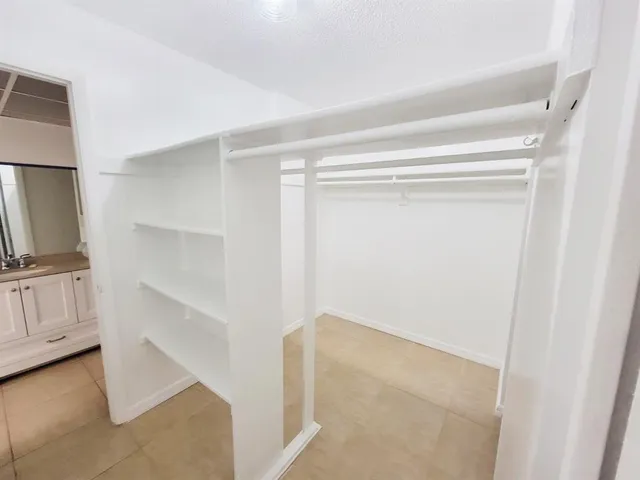a view of an empty walk in closet